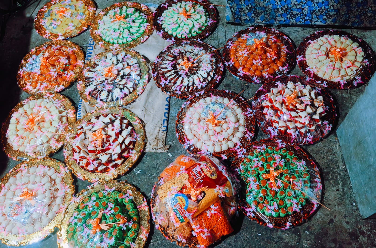 Celebration platters of assorted mithai wrapped and ready